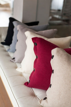 Pictured: all six colors of pillows arranged on a couch.